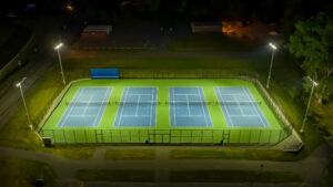 Tennis Court lighting at night (Tennis Court Lighting Contractors)