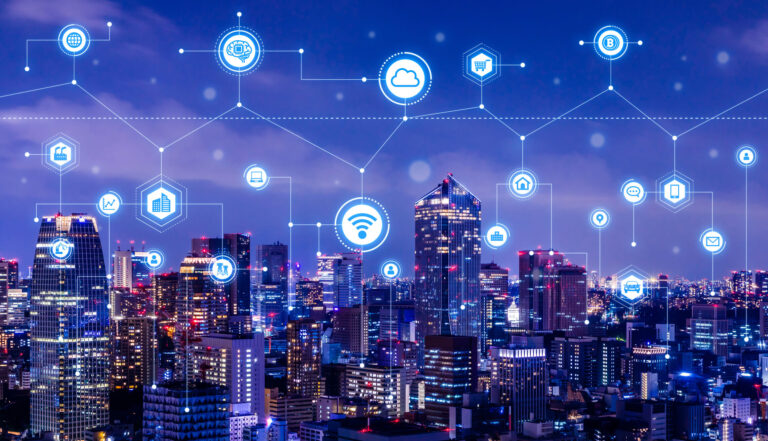 Image of a smart city with techy lines connecting arounfd the top. Operational efficiency