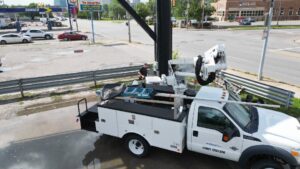 Truck roll with person checking unit on billboard